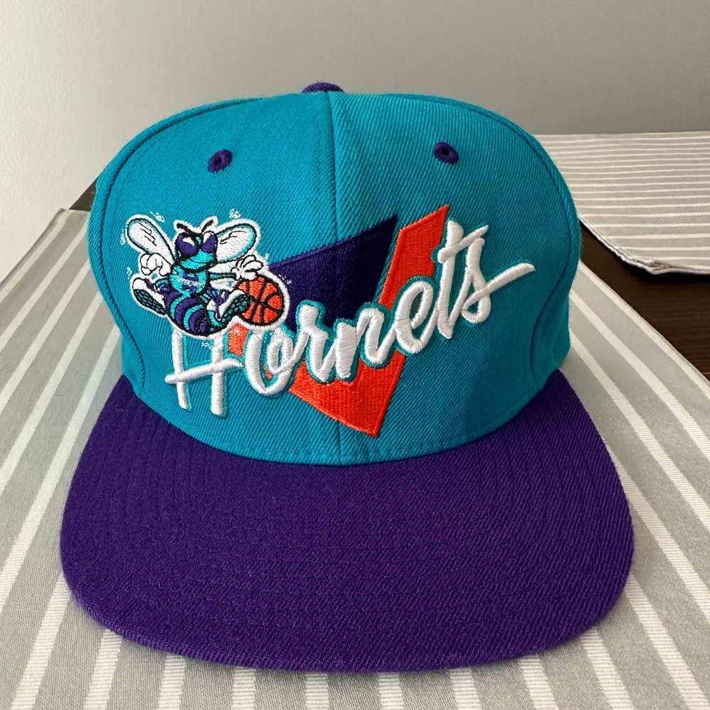 Charlotte Hornets flat brim hat in brand new condition.